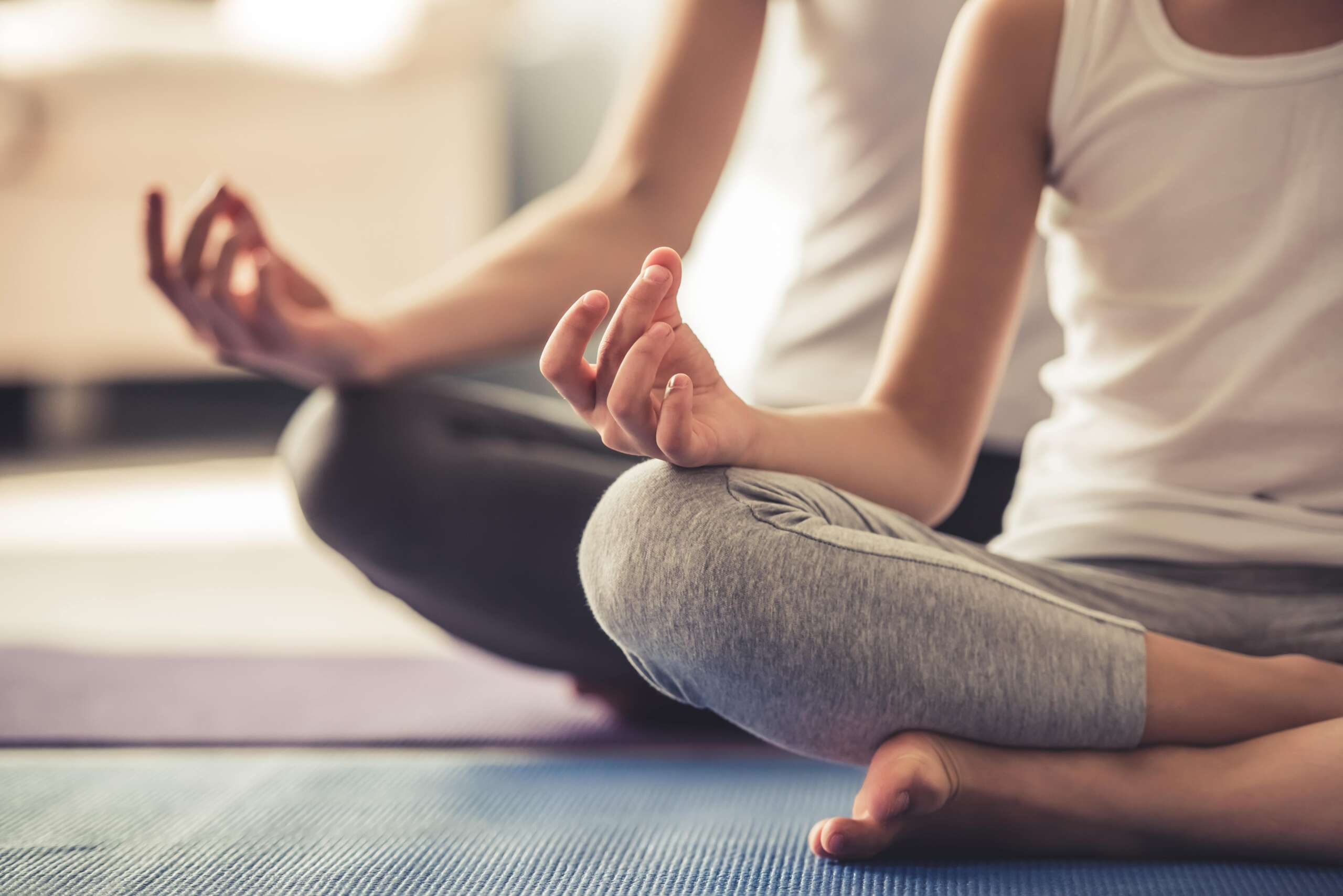 People doing yoga during holistic therapy in San Diego.